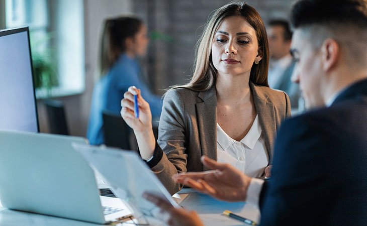 How To Successfully Negotiate Salary: +50 Tips &Amp; Strategies Independent Recruiter LLC | Staffing Agency confident woman in an interview with a man