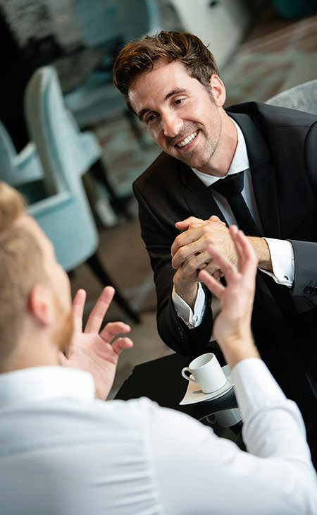 How To Successfully Negotiate Salary: +50 Tips &Amp; Strategies Independent Recruiter LLC | Staffing Agency smiling men in a job interview