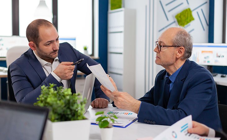 How To Successfully Negotiate Salary: +50 Tips &Amp; Strategies Independent Recruiter LLC | Staffing Agency two serious men negotiating in an interview