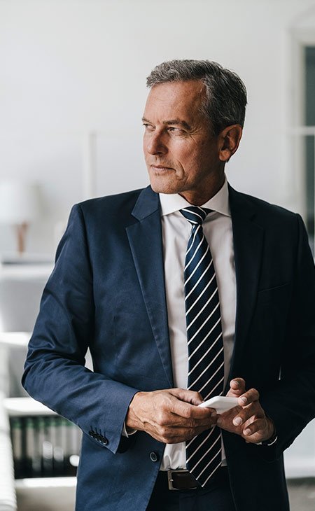 Job Description For Directors: Sample, Tips &Amp; Templates Independent Recruiter LLC | Staffing Agency man-suit-looking-away