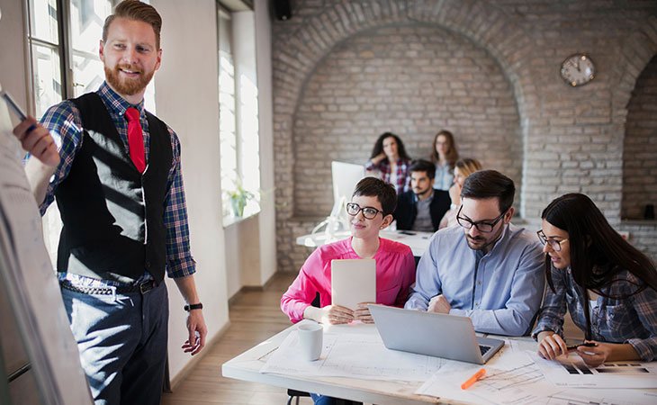 100+ Interview Questions For Product Managers + Answers Independent Recruiter LLC | Staffing Agency man-teaching-people