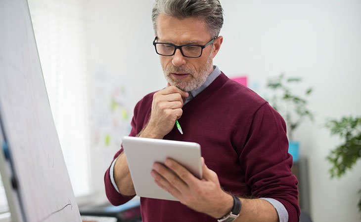 Job Description For Directors: Sample, Tips &Amp; Templates Independent Recruiter LLC | Staffing Agency man-thinking-hand-chin-tablet