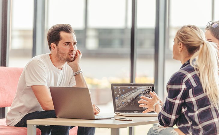 100+ Interview Questions For Product Managers + Answers Independent Recruiter LLC | Staffing Agency people-sitting-table-laptops