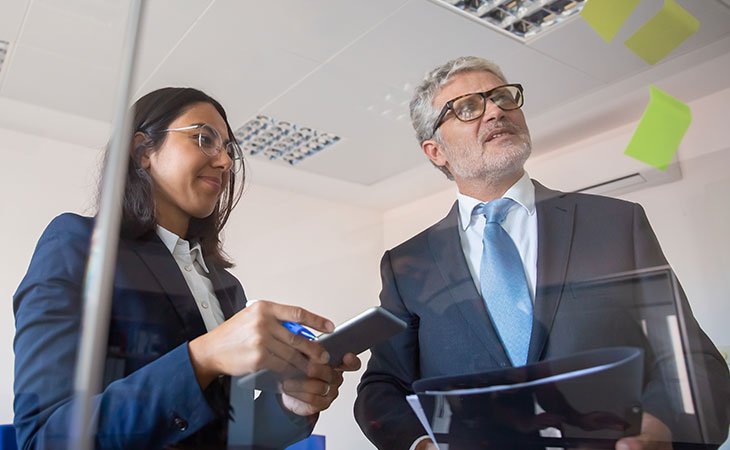 Job Description For Directors: Sample, Tips &Amp; Templates Independent Recruiter LLC | Staffing Agency two-people-smiling-post-it-glass
