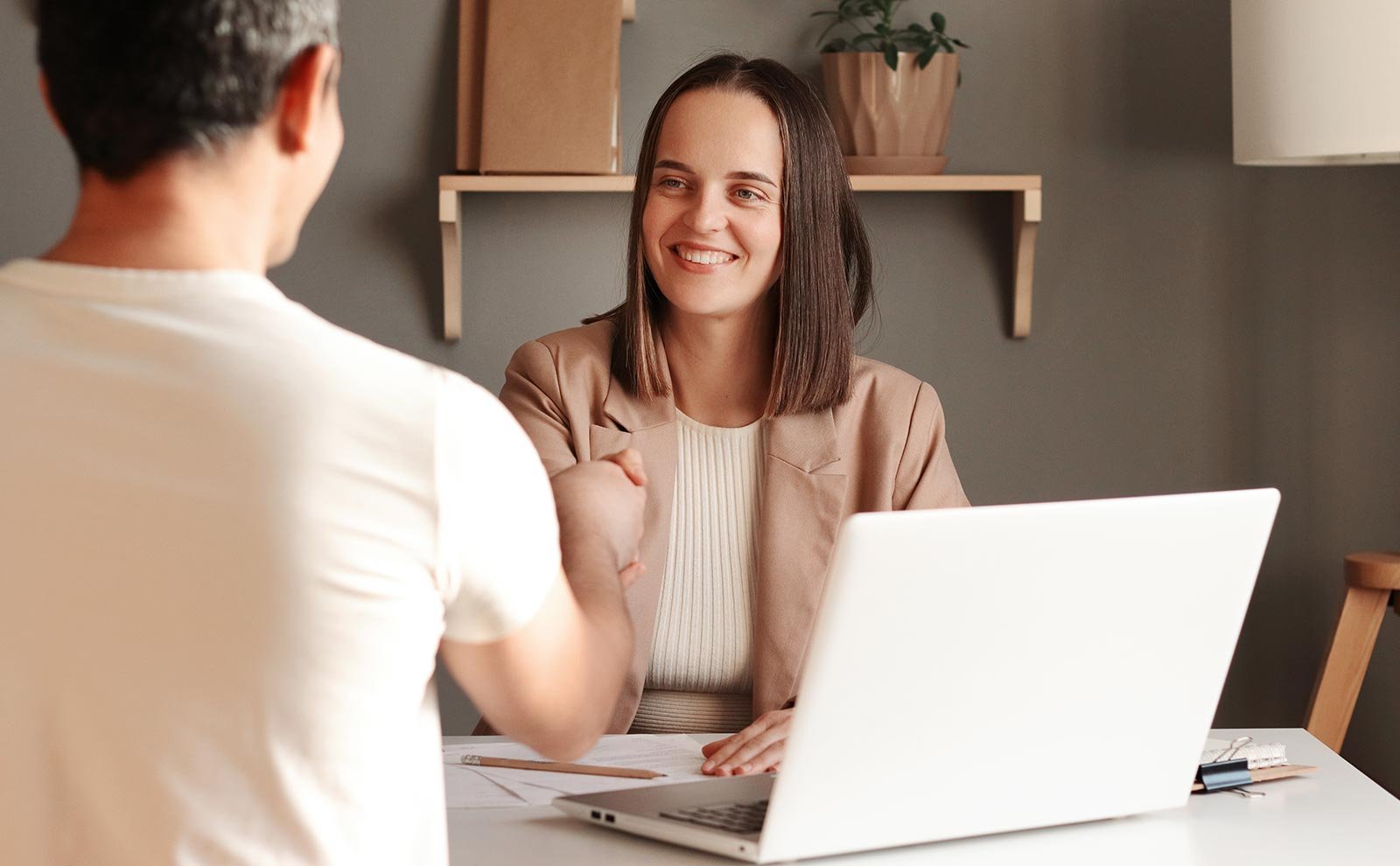 woman-smiling-handshake-man