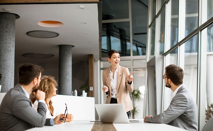Job Description For Directors: Sample, Tips &Amp; Templates Independent Recruiter LLC | Staffing Agency woman-speech-office-meeting