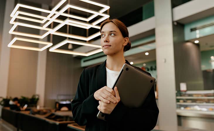 woman-looking-up-laptop-hands
