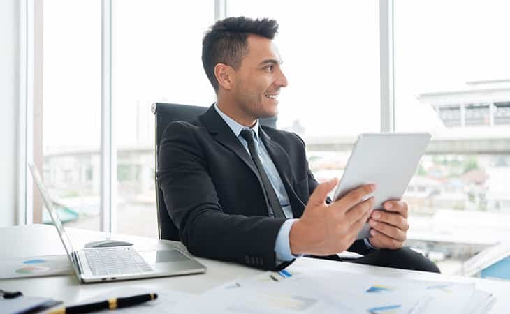 smiling-man-holding-tablet