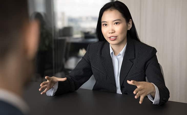 woman talking with her hands open